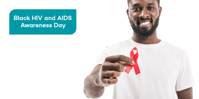 African American man holding red ribbon